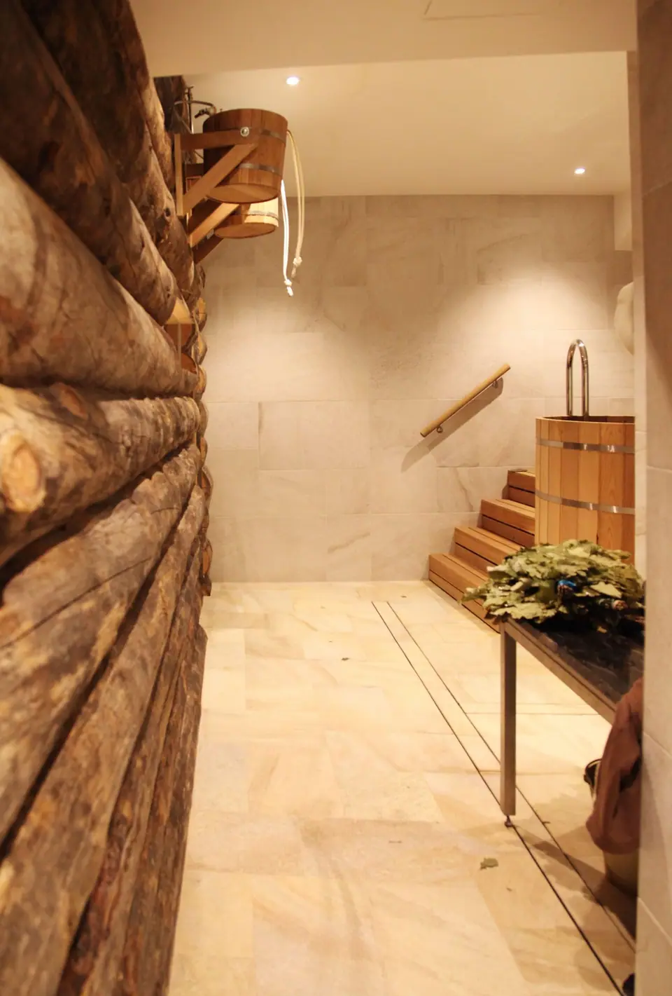 Corridor lined with logs leading to the plunge area