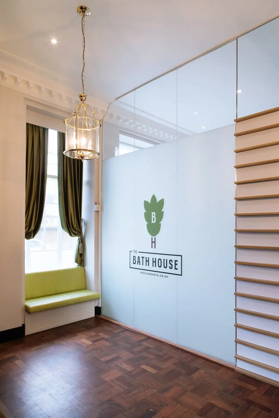 Entrance hall at The Bath House with crystal pendant and herringbone parquet