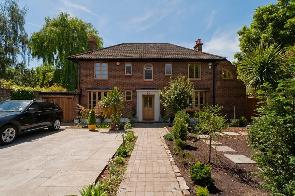 Front of the Blackheath house with new block-paved drive and planting