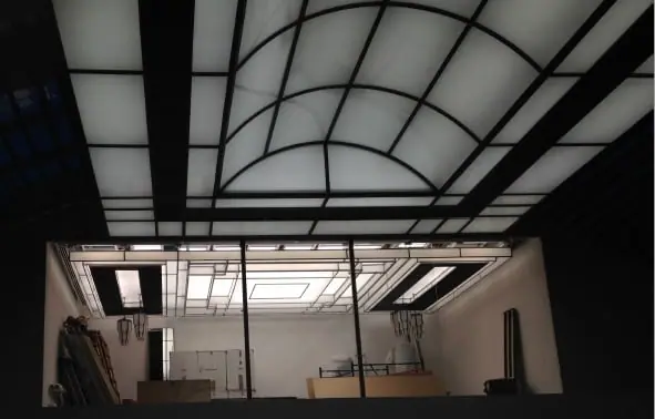 Illuminated ceiling frame being installed during construction