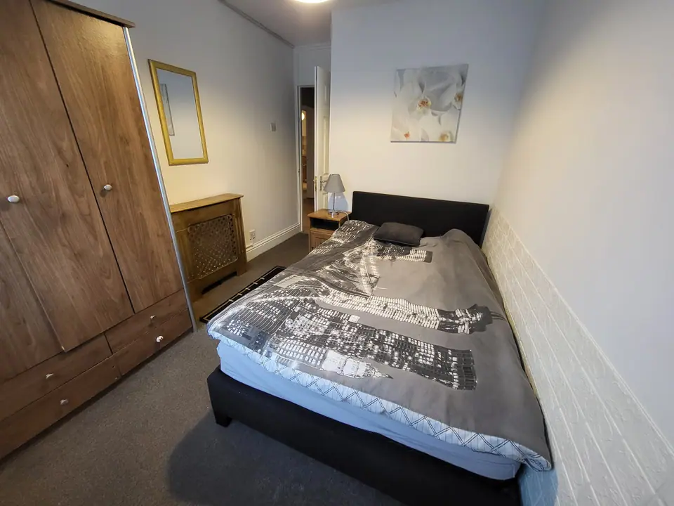 Bedroom with double bed and fitted wardrobe