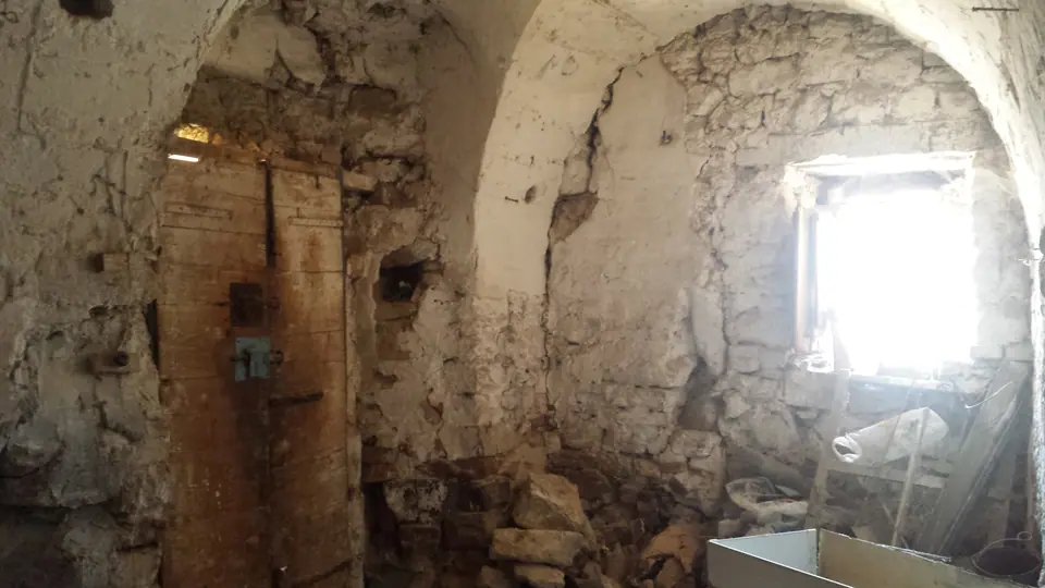 Derelict stone cellar before renovation