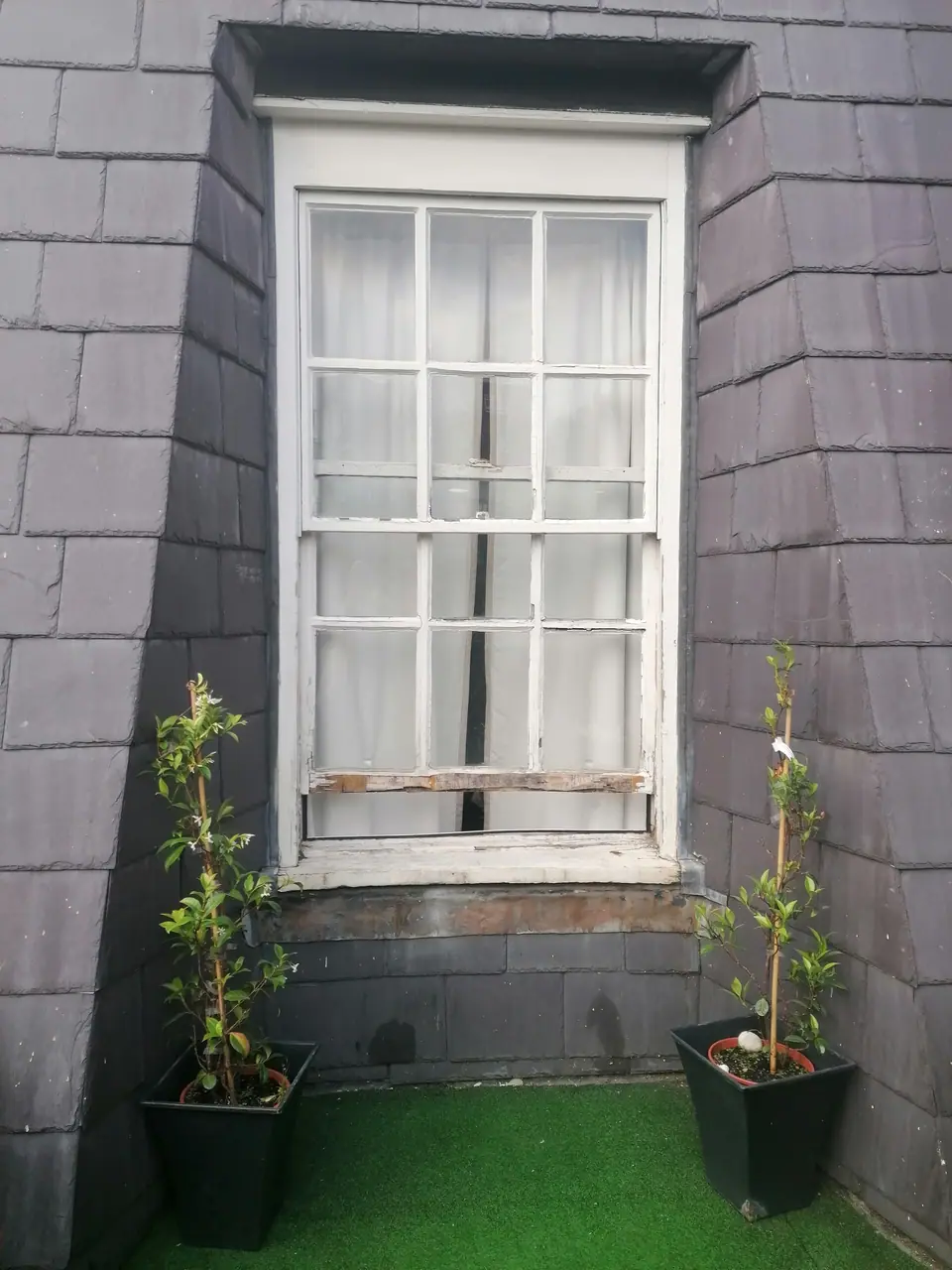 Original sash window onto the roof