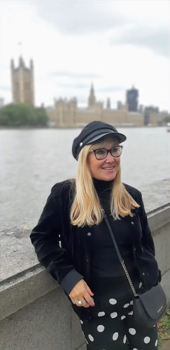 Natalia, founder of Natalia Interior Design, on the Thames embankment opposite the Palace of Westminster