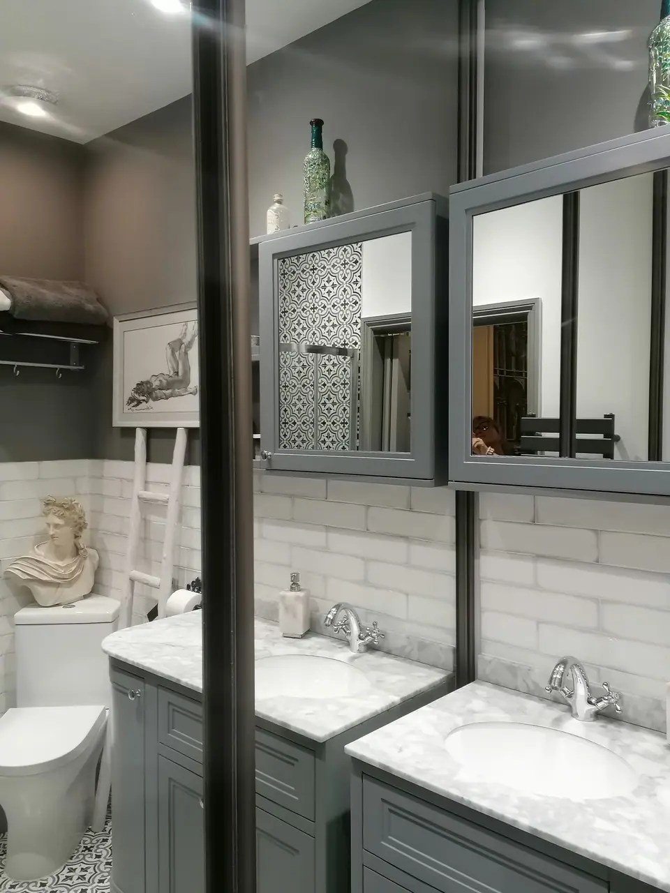 New en-suite with grey double vanity and mirrored cabinets