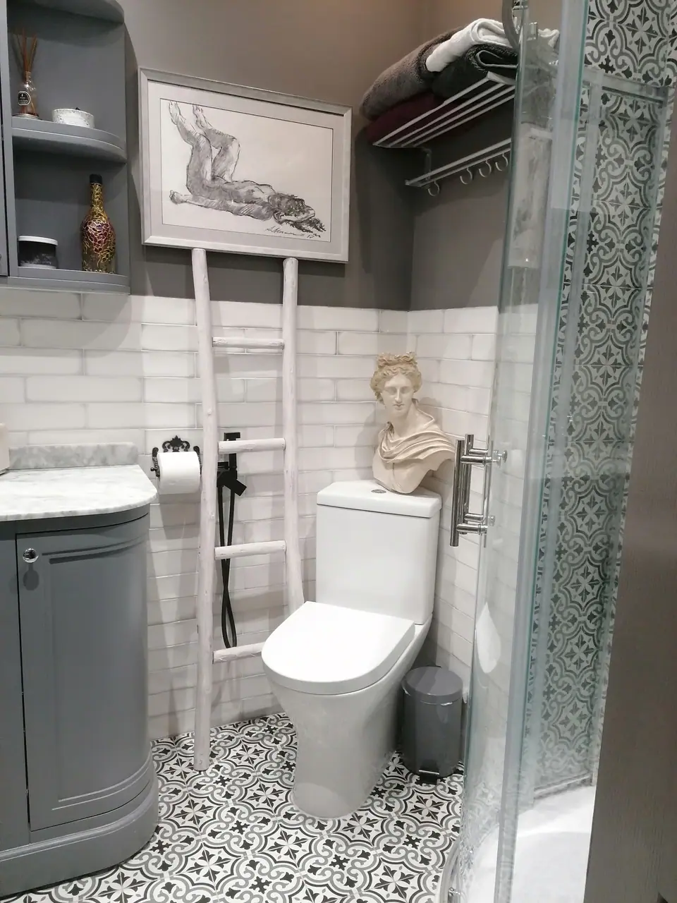 En-suite shower room with metro tiles and patterned floor tiles