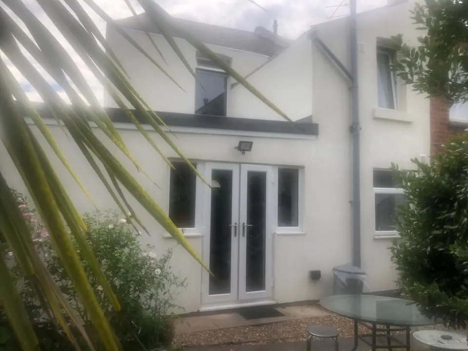French doors of the new extension opening onto the patio
